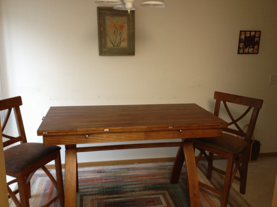 separate dining area large enough to extent the table. the owner is willing to leave some furnishings if desired.